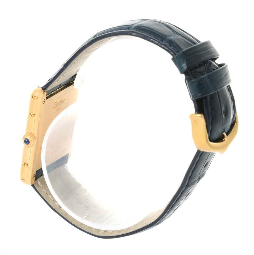 The image shows a side view of the Cartier Tank Classic Men's Yellow Gold White Dial Men's Yellow Gold White Dial watch with the strap and clasp visible.