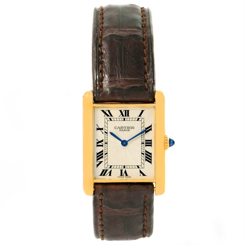 The image shows a front view of the Cartier Tank Classic Yellow Gold Silver Dial Yellow Gold Silver Dial watch, highlighting its rectangular face, leather strap, and Roman numeral indices.