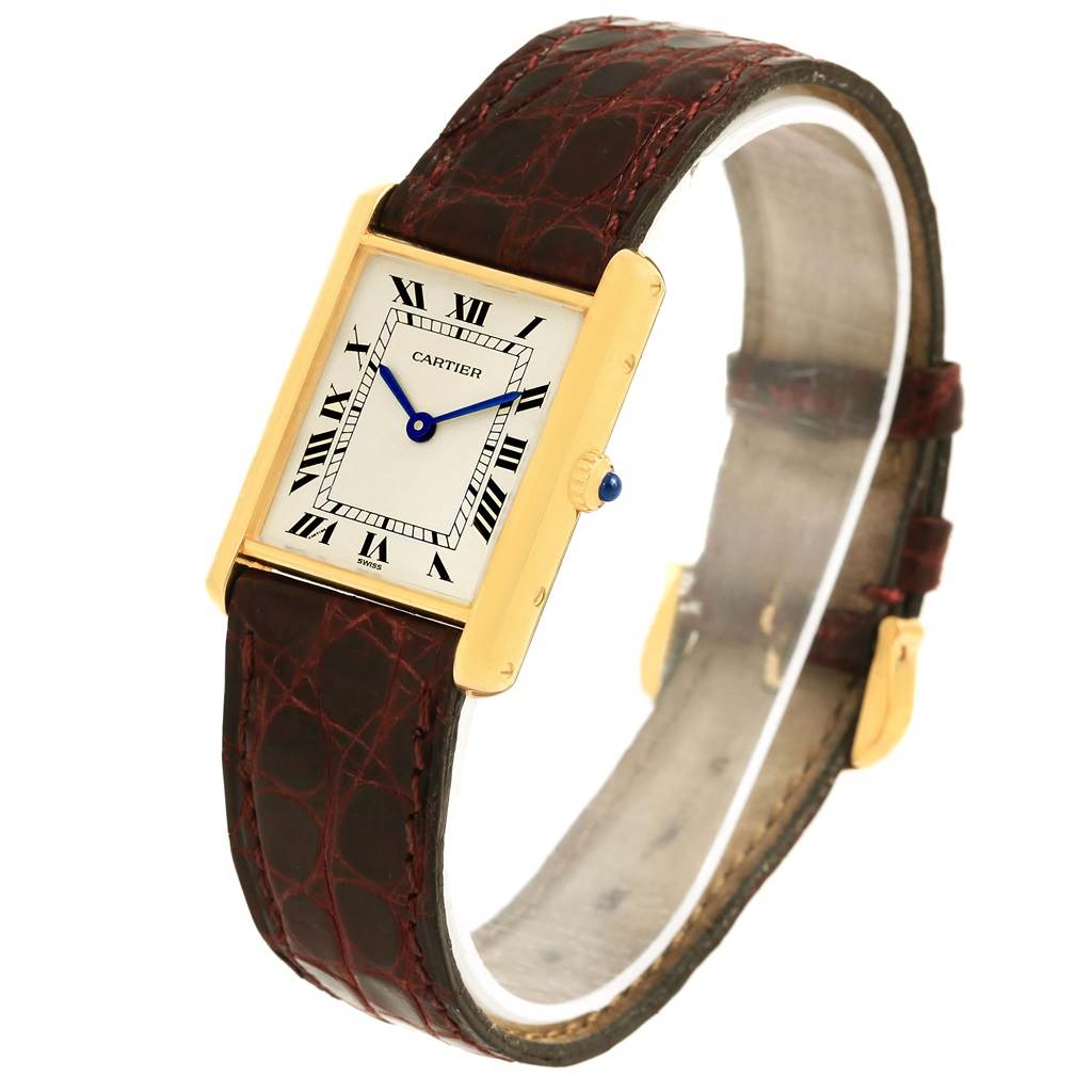 The image shows a Cartier Tank Classic 1140 Yellow Gold White Dial 1140 Yellow Gold White Dial watch at a 3/4 angle, featuring its rectangular face, leather strap, and Roman numeral dial.