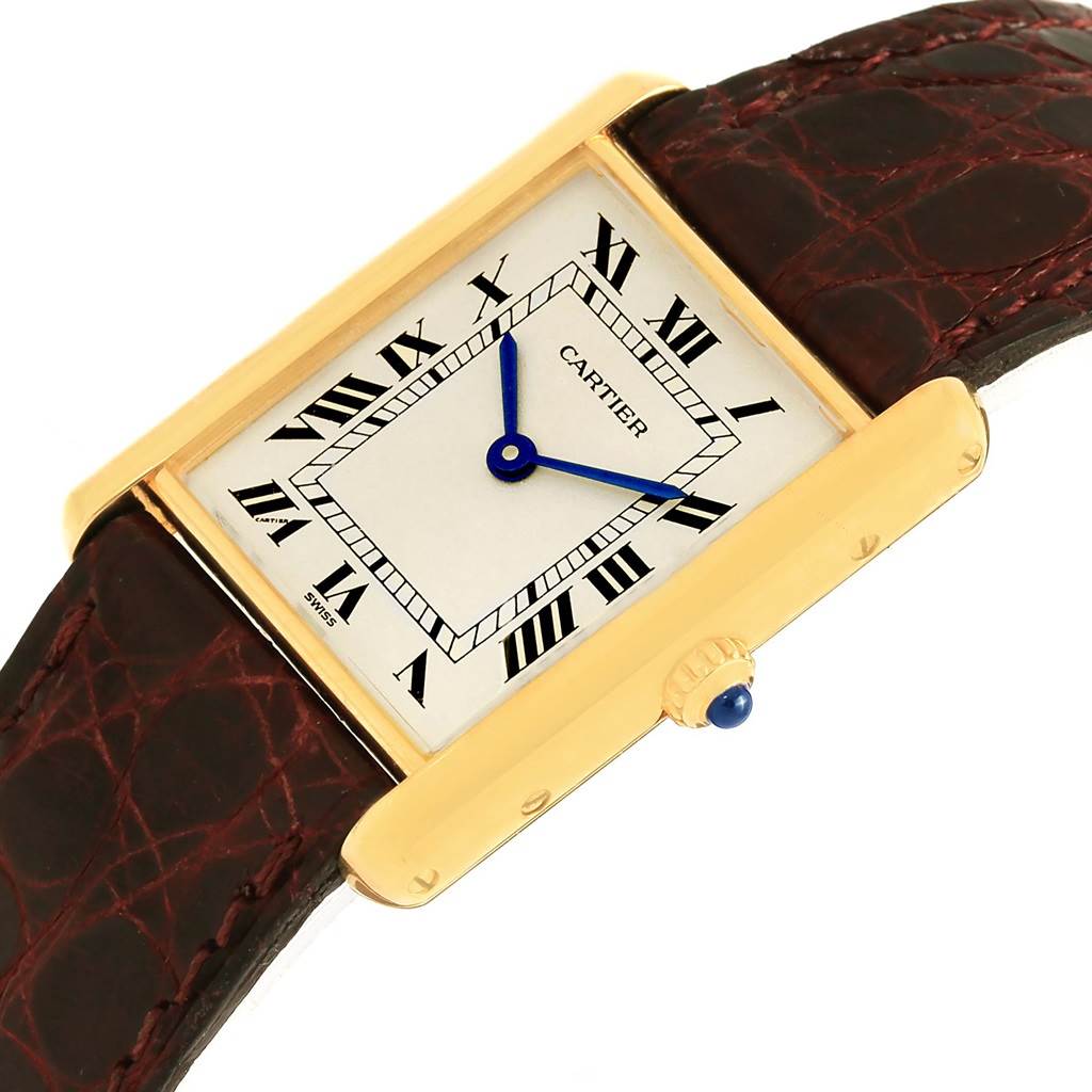 This is a close-up view of a Cartier Tank Classic 1140 Yellow Gold White Dial 1140 Yellow Gold White Dial watch displaying the dial, crown, and leather strap.