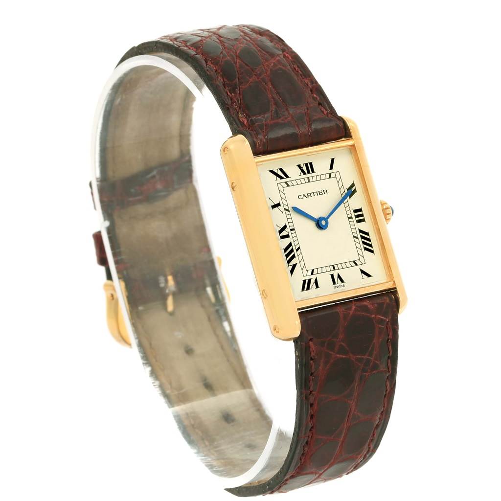 This image shows the Tank Classic model by Cartier from an angled side view, highlighting the watch face and leather strap.