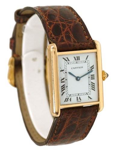 The image shows a Cartier Tank Classic Men's Yellow Gold White Dial Men's Yellow Gold White Dial watch at an angle displaying its face, leather strap, and gold rectangular case.