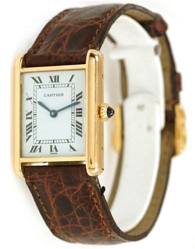 The image shows a Cartier Tank Classic Men's Yellow Gold White Dial Men's Yellow Gold White Dial watch at a slight angle, displaying the face, gold casing, crown, and brown leather strap.