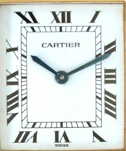 This image shows a close-up of the face of a Tank Classic model by Cartier, displaying Roman numerals and blue hands.