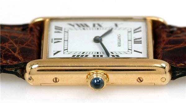 This image shows a side view of the Cartier Tank Classic Men's Yellow Gold White Dial Men's Yellow Gold White Dial watch, focusing on its crown and part of the rectangular face.