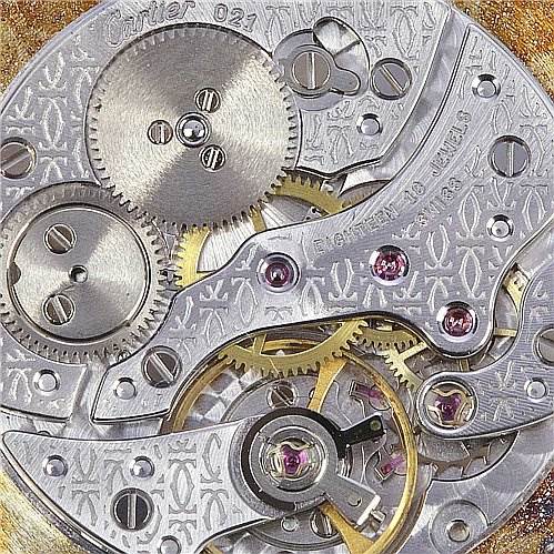 This image shows the intricate internal mechanism of the Cartier Tank Classic Platinum White Dial Platinum White Dial model watch, viewed close-up from the back.