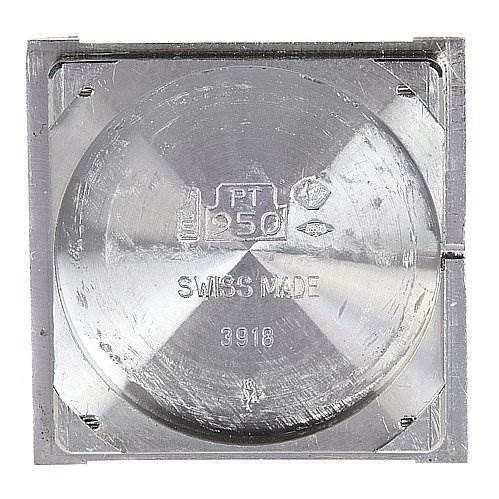 The image shows the back cover of a Tank Classic model by Cartier, viewed from a direct top-down angle.