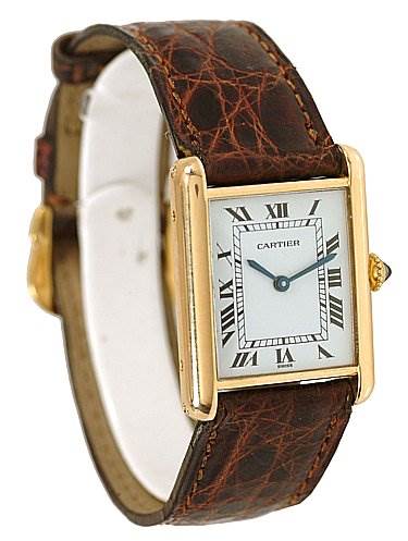 The image shows the face and leather strap of the Cartier Tank Classic Women's Yellow Gold White Dial Women's Yellow Gold White Dial watch from a slight side angle.