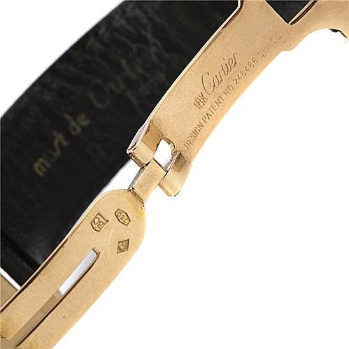 This image shows a close-up of the clasp and part of the strap for the Cartier Tank Classic Yellow Gold White Dial Yellow Gold White Dial watch.