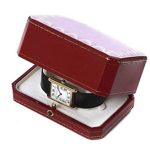 The Cartier Tank Classic Yellow Gold White Dial Yellow Gold White Dial watch is displayed in a slightly open red box, showing its face, gold case, and strap.