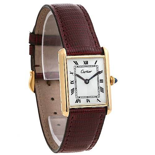 The image shows a Cartier Tank Classic Yellow Gold White Dial Yellow Gold White Dial watch at an angle highlighting the watch face, gold rectangular case, and maroon leather strap.