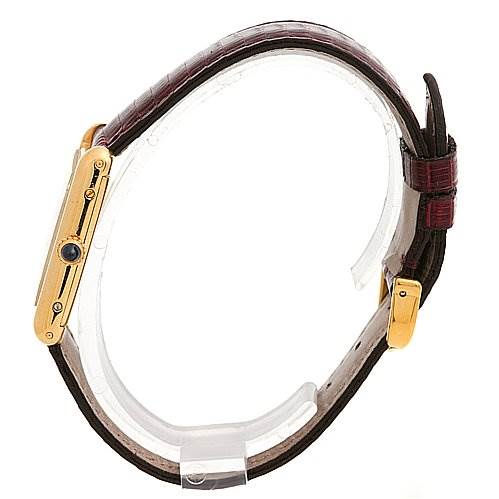 This side view shows the Tank Classic model by Cartier, highlighting the watch case, crown, and leather strap.