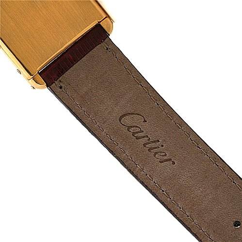 The image shows the back side of the strap on a Tank Classic watch by Cartier with "Cartier" engraved.