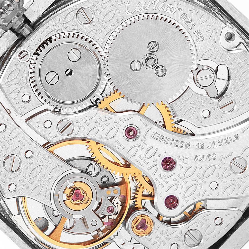 Close-up view of the internal mechanics of the Cartier Tank Classic Men's Platinum Silver Dial Men's Platinum Silver Dial watch, showing gears and precision components.