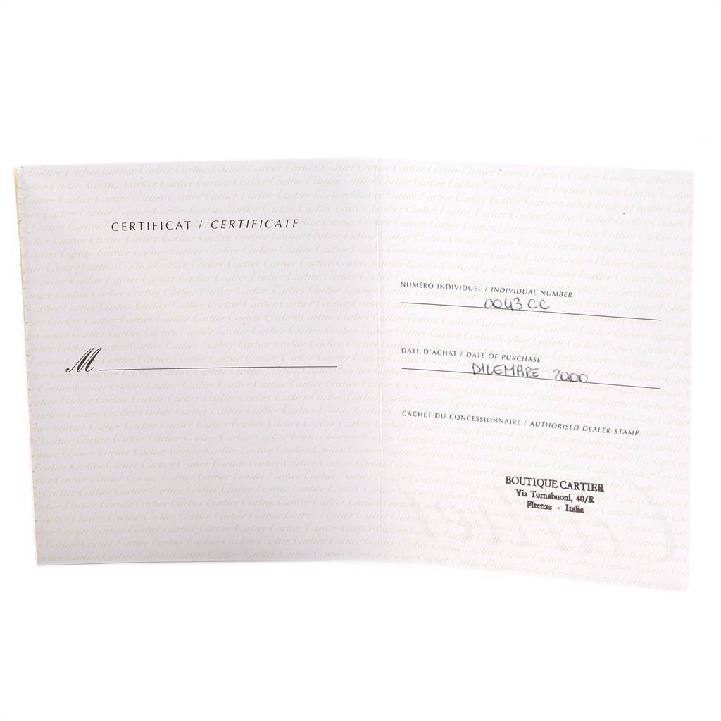 This image shows an opened certificate for the Cartier Tank Classic Men's Platinum Silver Dial Men's Platinum Silver Dial watch, including purchase details and dealer stamp.