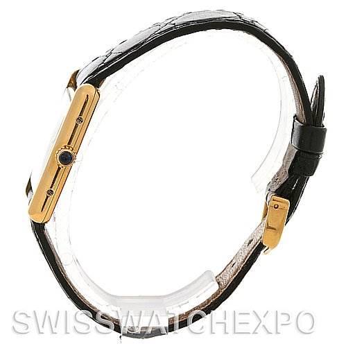 The image shows a side view of the Tank Classic model by Cartier, highlighting its case, crown, and black leather strap.