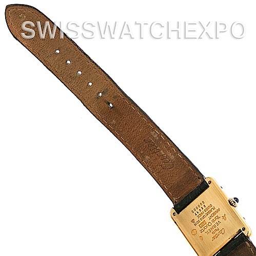 The image shows the back casing and brown leather strap of the Cartier Tank Classic Yellow Gold Champagne Dial Yellow Gold Champagne Dial watch.