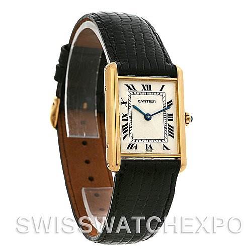 This image shows the Cartier Tank Classic Yellow Gold White Dial Yellow Gold White Dial watch from an angled side view, highlighting the watch face, case, and black leather band.