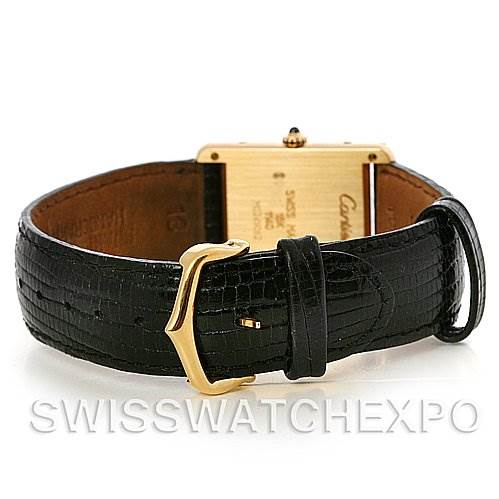 The image shows the back of a Cartier Tank Classic Yellow Gold White Dial Yellow Gold White Dial watch, highlighting its leather strap and gold buckle.