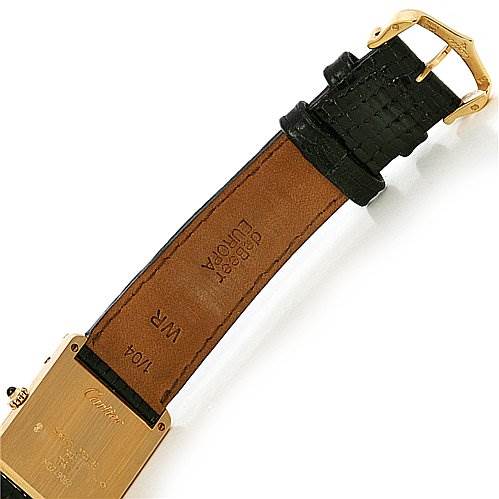 The image shows the underside of the strap and case back of a Cartier Tank Classic Yellow Gold White Dial Yellow Gold White Dial watch.