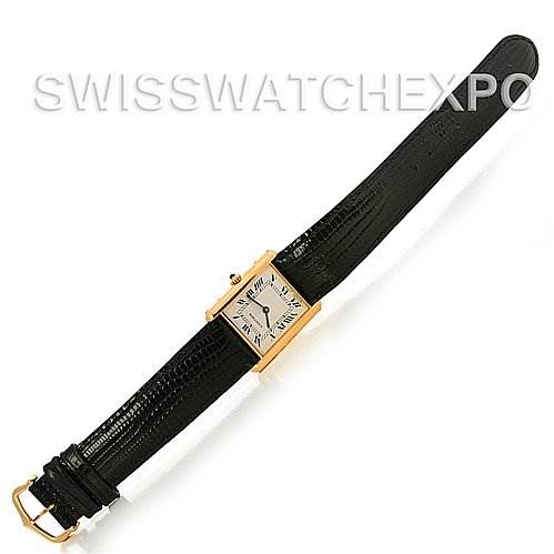 The Cartier Tank Classic Yellow Gold White Dial Yellow Gold White Dial watch is shown from a top-down angle, displaying its rectangular face and black leather strap.