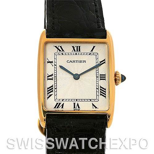 The image shows a front view of the Cartier Tank Classic 2466 Yellow Gold Silver Dial 2466 Yellow Gold Silver Dial watch, displaying its face, Roman numerals, hands, and part of the leather strap.