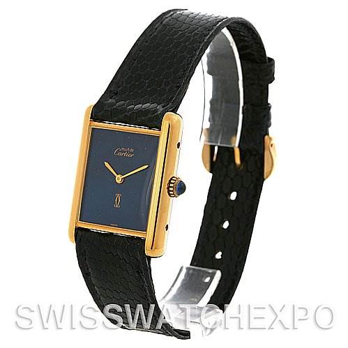 This image shows a Cartier Tank Classic Yellow Gold Blue Dial Yellow Gold Blue Dial model watch at an angle highlighting the black leather strap, gold-tone case, and blue dial.