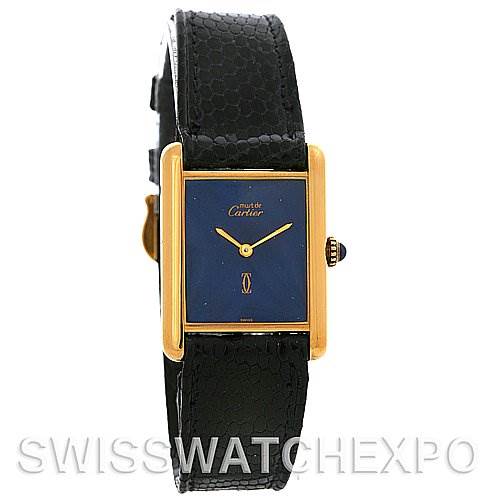 The image shows a front-facing view of a Cartier Tank Classic Yellow Gold Blue Dial Yellow Gold Blue Dial watch, displaying its rectangular face and black strap.