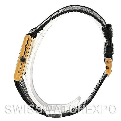 The image shows a side profile of the Cartier Tank Classic Yellow Gold Blue Dial Yellow Gold Blue Dial watch, highlighting the case and strap.