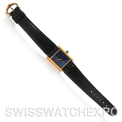 The Cartier Tank Classic Yellow Gold Blue Dial Yellow Gold Blue Dial watch is shown from a top-down angle, displaying its black leather strap and rectangular gold case with a blue dial.