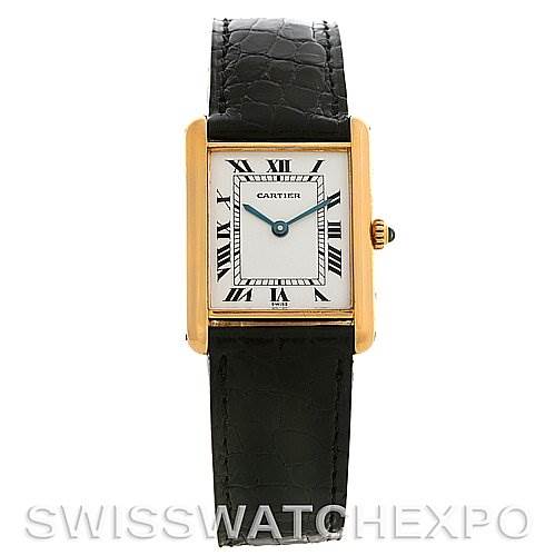 The image shows a Cartier Tank Classic Yellow Gold White Dial Yellow Gold White Dial watch front view, displaying its rectangular dial, Roman numerals, black leather strap, and gold casing.