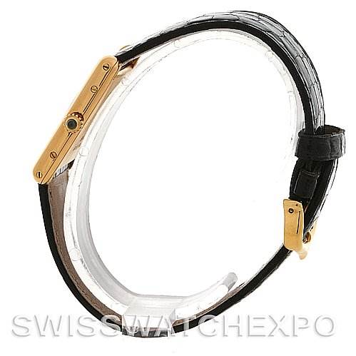 This image shows a side view of the Cartier Tank Classic Yellow Gold White Dial Yellow Gold White Dial watch, focusing on the case, crown, and strap.