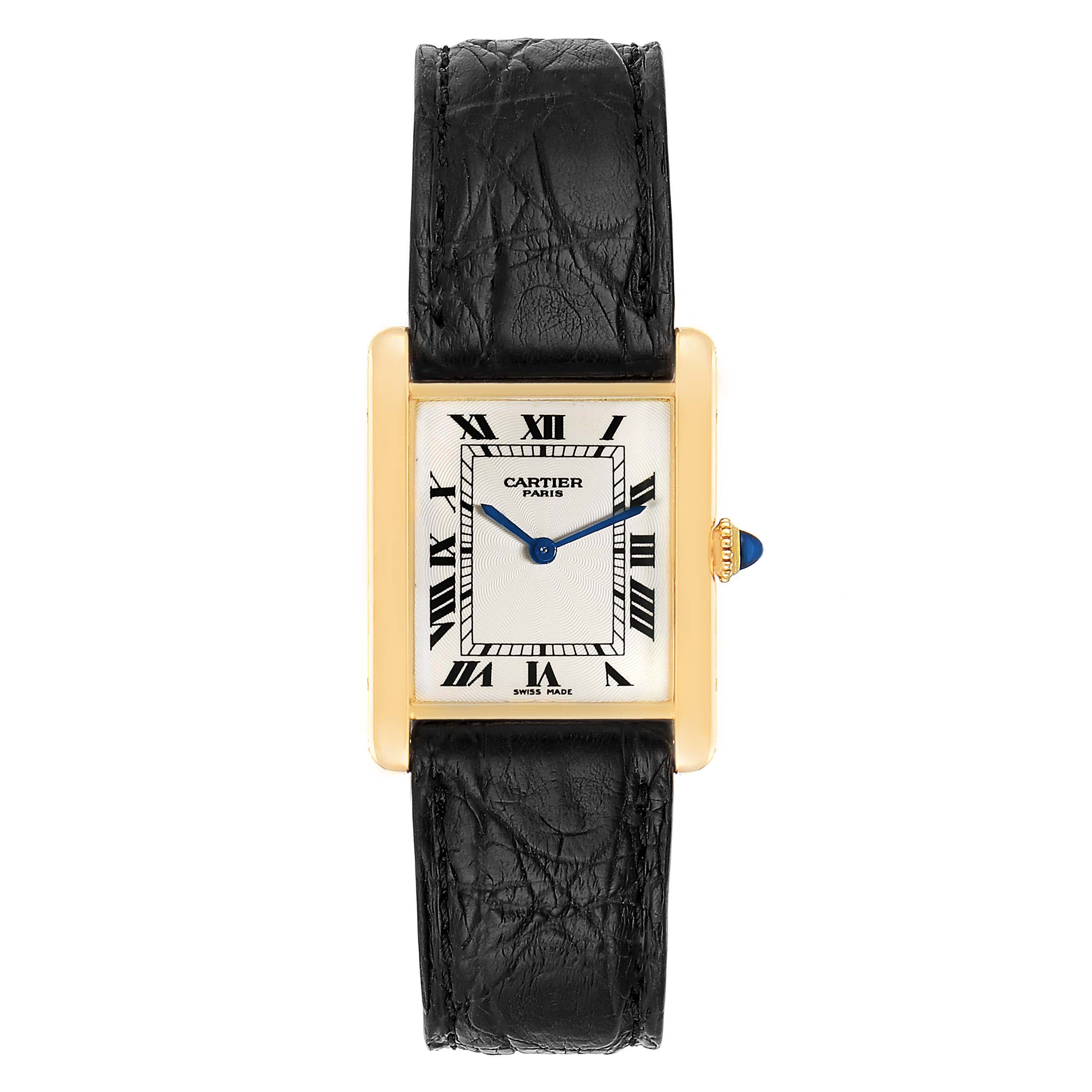 The image shows a Cartier Tank Classic Men
s Yellow Gold Silver Dial Men
s Yellow Gold Silver Dial model watch from a front view, highlighting its black leather strap and rectangular gold case.