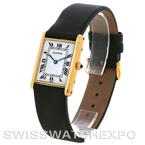 This image shows a Cartier Tank Classic Yellow Gold White Dial Yellow Gold White Dial watch viewed from a front angle, displaying its face, bezel, crown, and strap.