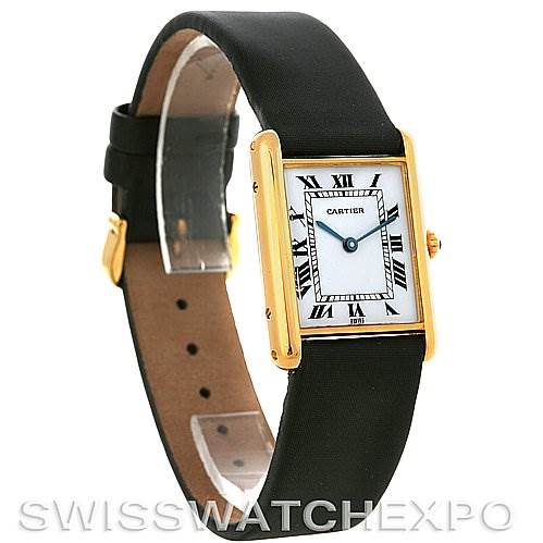 The image shows a Cartier Tank Classic Yellow Gold White Dial Yellow Gold White Dial watch at a three-quarter angle, displaying the watch face, strap, and buckle.