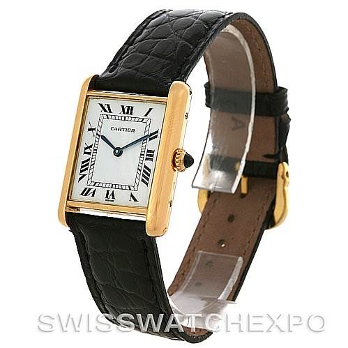 The image shows a Cartier Tank Classic Yellow Gold White Dial Yellow Gold White Dial model watch at a three-quarter angle, highlighting its face, dial, and leather strap.