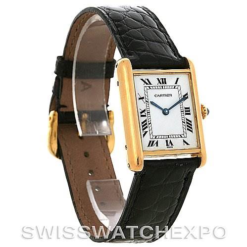 The image shows a side profile and front angle of the Cartier Tank Classic Yellow Gold White Dial Yellow Gold White Dial watch, highlighting the face, strap, and clasp.