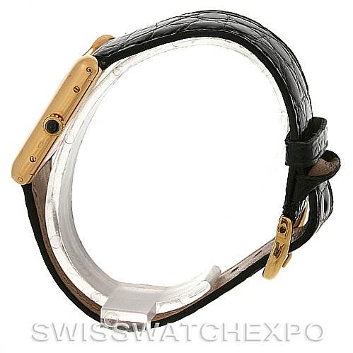 Side view of the Cartier Tank Classic Yellow Gold White Dial Yellow Gold White Dial watch showcasing its case, crown, and black leather strap.