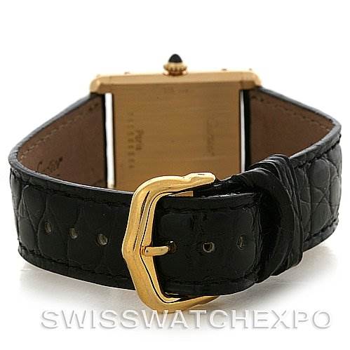 The image shows the Cartier Tank Classic Yellow Gold White Dial Yellow Gold White Dial watch from the rear, highlighting its black leather strap and gold buckle.