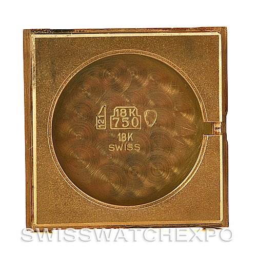 This is the inner case back of a Cartier Tank Classic Yellow Gold White Dial Yellow Gold White Dial watch, showing its gold markings and engravings.