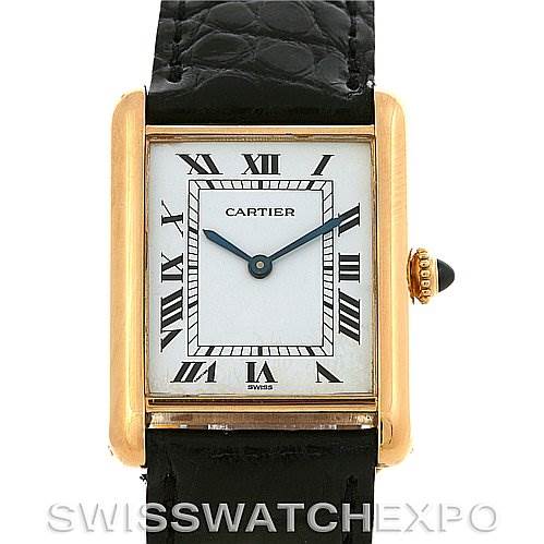 Front view of the Cartier Tank Classic Yellow Gold White Dial Yellow Gold White Dial watch showing its dial, Roman numerals, hands, and part of the leather strap.