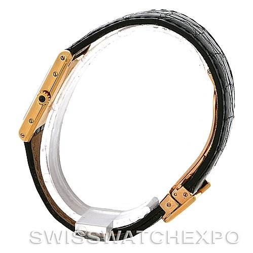 This is a side view of a Cartier Tank Classic Yellow Gold White Dial Yellow Gold White Dial watch showing the black strap and gold case from Buy Best Quality Watches
.