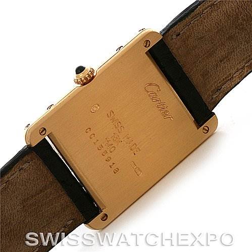This image shows the back of a Tank Classic watch by Cartier, displaying the case back and leather straps.
