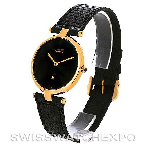 This image shows a Cartier Tank Classic Yellow Gold Black Dial Yellow Gold Black Dial model watch at a three-quarter angle, highlighting the round black dial, gold case, and black strap.