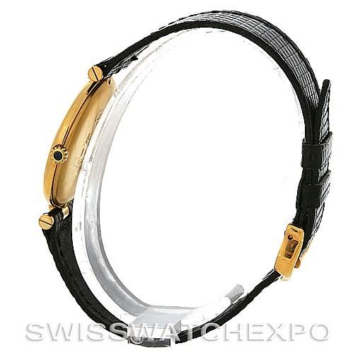 The image shows a Cartier Tank Classic Yellow Gold Black Dial Yellow Gold Black Dial model watch from a side angle, highlighting its slim case and black leather strap.