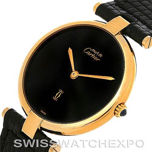 This is an angled view of the Cartier Tank Classic Yellow Gold Black Dial Yellow Gold Black Dial watch, highlighting the black dial, gold case, and black leather strap.