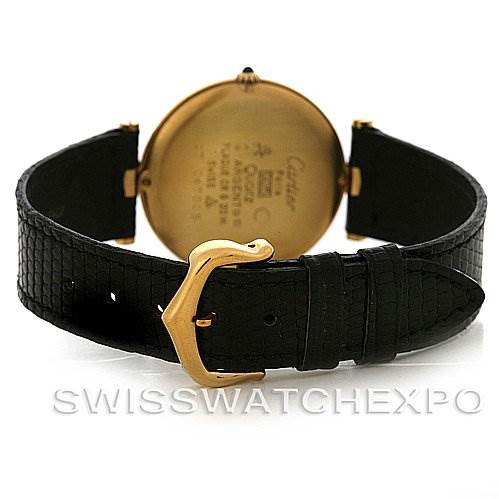 The image shows the back view of a Cartier Tank Classic Yellow Gold Black Dial Yellow Gold Black Dial watch, highlighting the case back, black strap, and gold buckle.