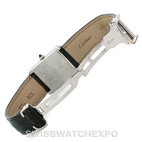 The image shows the underside and clasp of a Cartier Tank Classic Men's Platinum Silver Dial Men's Platinum Silver Dial model watch, revealing the brand name and leather strap.