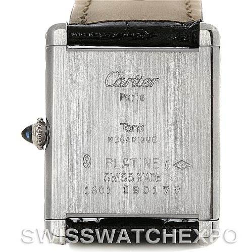 The image shows the back case of a Cartier Tank Classic Men's Platinum Silver Dial Men's Platinum Silver Dial watch, highlighting engravings and serial number.