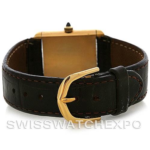 The image shows the back view of a Cartier Tank Classic Yellow Gold White Dial Yellow Gold White Dial watch, highlighting the leather strap and gold buckle.